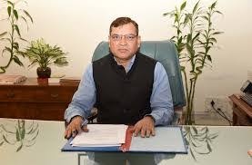 Dhirendra Ojha at his official desk with files