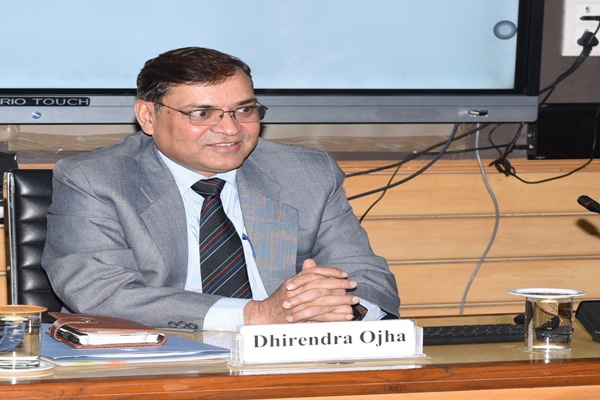 Dhirendra Ojha at PIB conference with nameplate